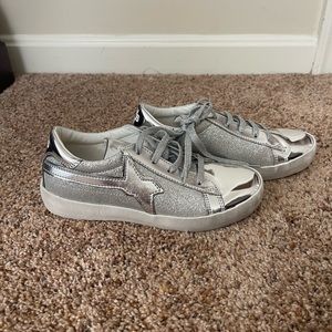 New, never been worn W6YZ Tennis Shoes. Size 3.5 color shiny silver and glitter